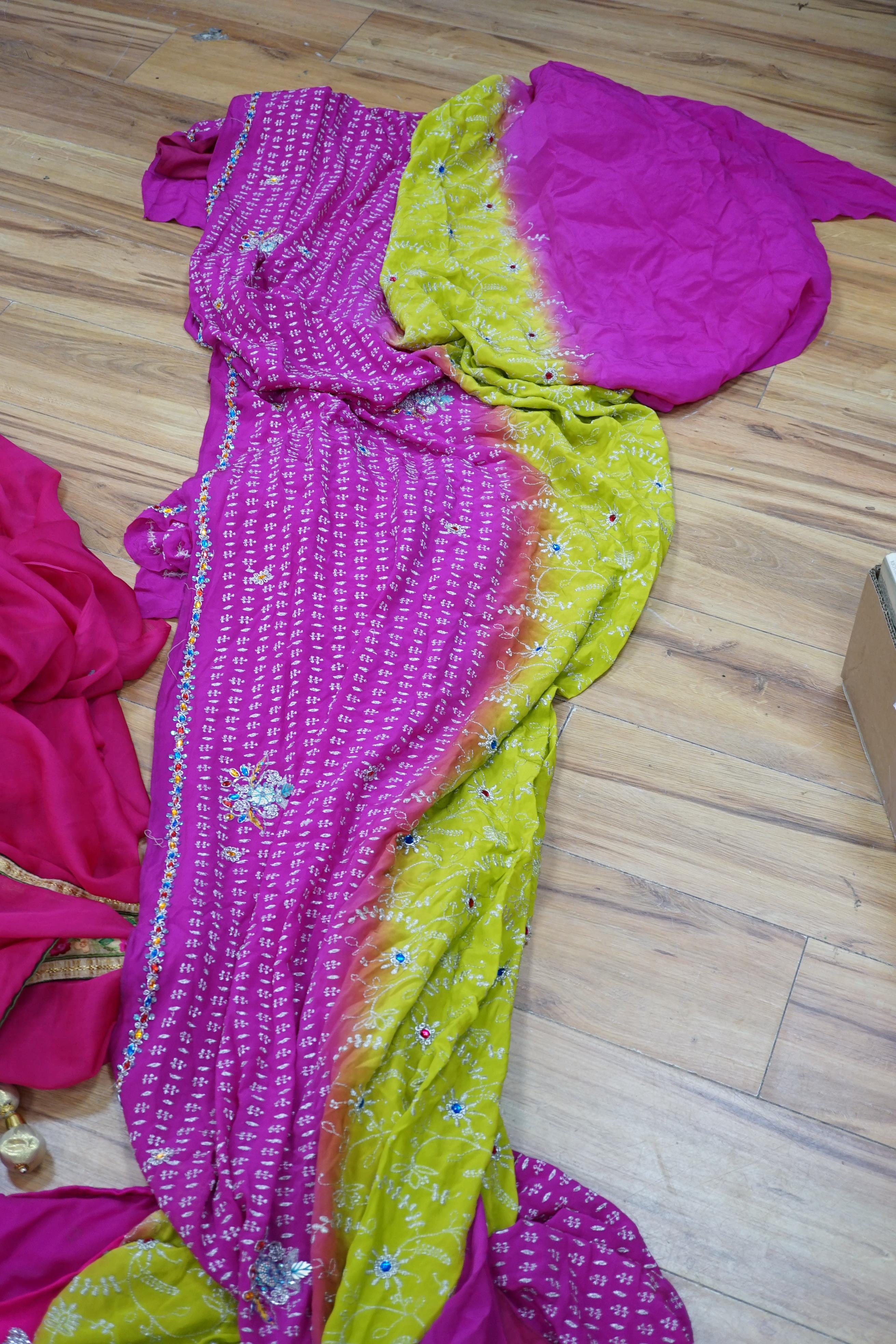 A collection of Indian silk saris and costume possibly bridal